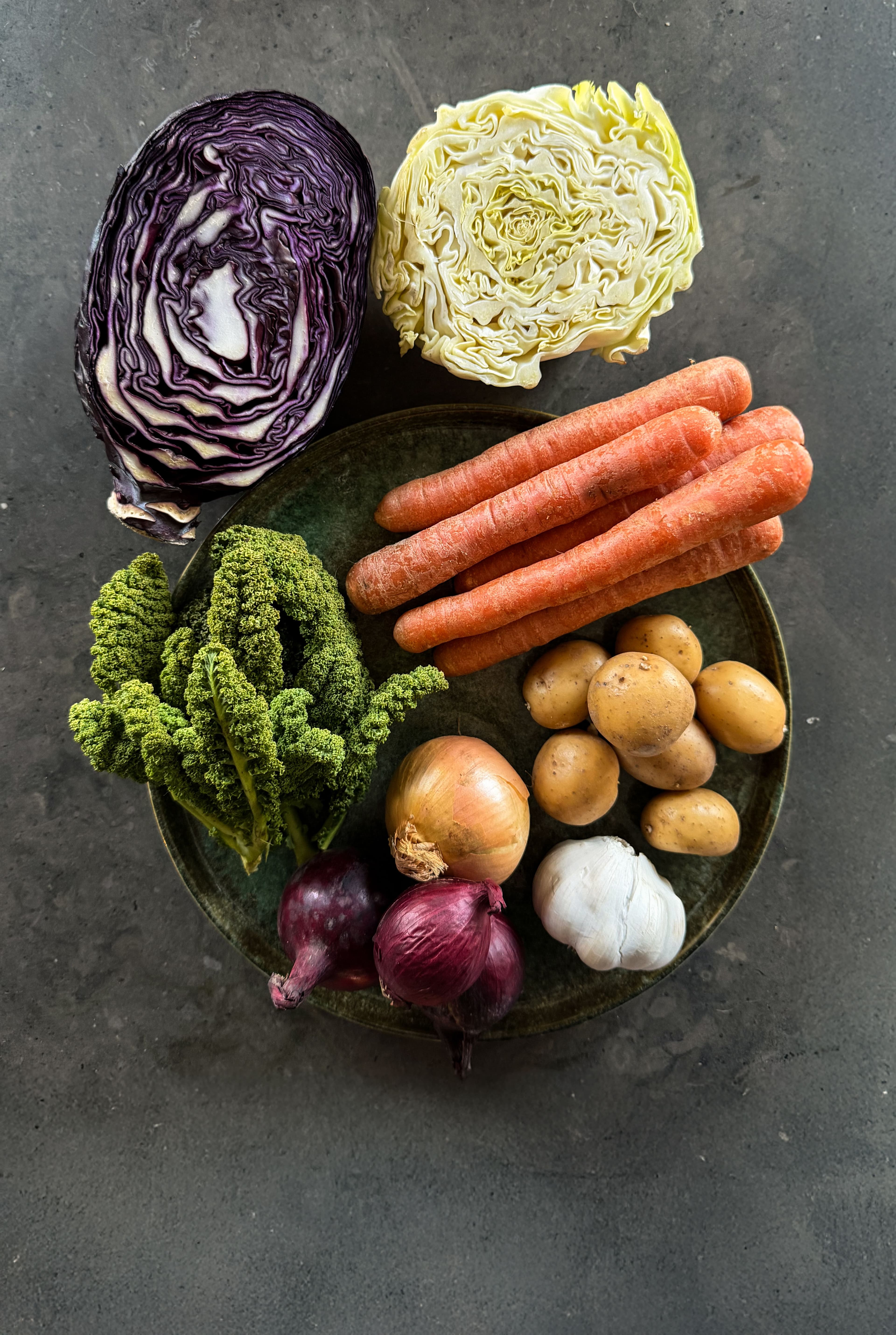 a bowl of seasonal crops from sweden, beets roots onion etc